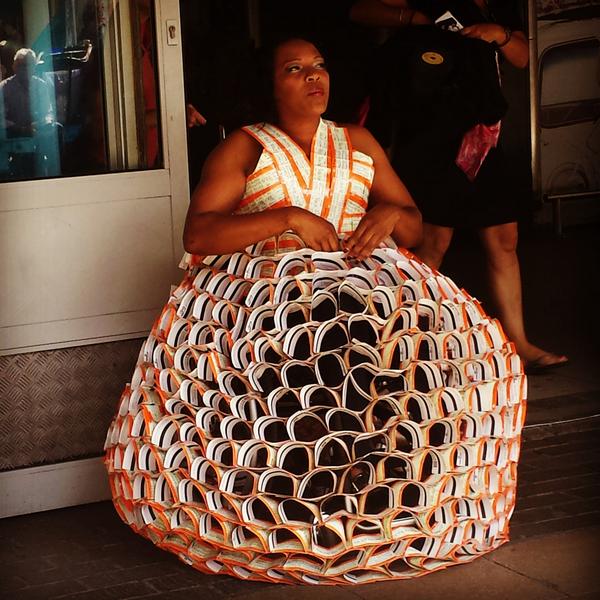 woman wears designer dress made out of 3 500 train tickets london tickets made