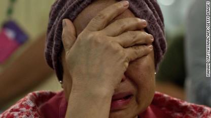 CNN's tweet image. Once again, Malaysia witnesses overwhelming grief of those whose loved ones may be lost cnn.it/1taU7NL  #MH17