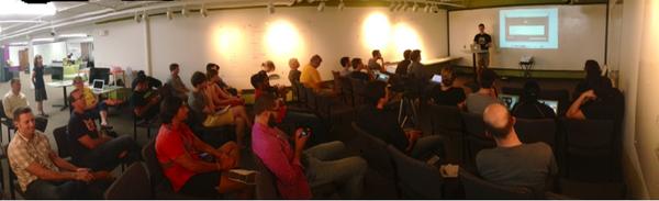 McNary's tweet image. At @DevIowa final demo today seeing progress of group this summer. Great program to get Iowa coding! (pic) #codemore