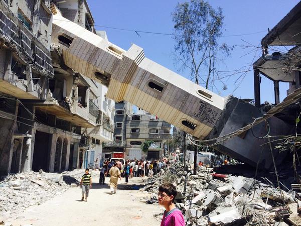 thompwalker's tweet photo. One of the towers of a mosque fell through an apartment block in #alshate camp in #Gaza.full story on #c4news tonight http://t.co/7sEZHcK5pi