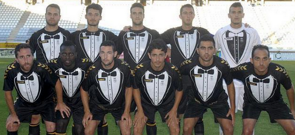 FootballFunnys's tweet photo. The Cultural Leonesa Tuxedo kit team photo! http://t.co/htXpeXG5Yd