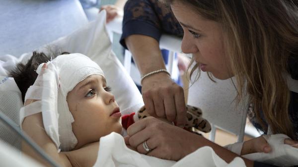 Auguste was born deaf, but a risky surgery may give this 3-year-old a chance to hear: lat.ms/1katn06