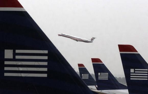 Reuters's tweet photo. Delta Air Lines, American Airlines and United Airlines halt flights to Israel: http://t.co/BEP1Ffswhb http://t.co/XUFQ7ypilS