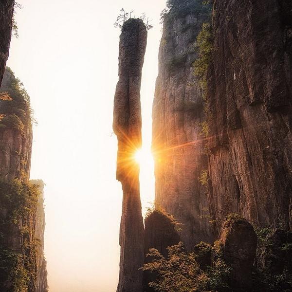 Photo @ladzinski / Sunrise illuminating the 'Incense Tower' in #EnshiGrandCanyon National Park in China. One of m...