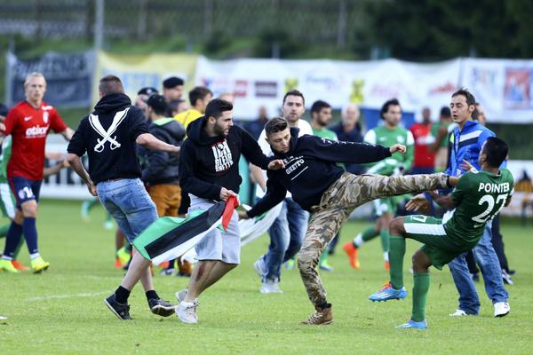 Pitch invasion sees pro-Palestinian protesters clash with Israeli football players  huff.to/1sWWOFu