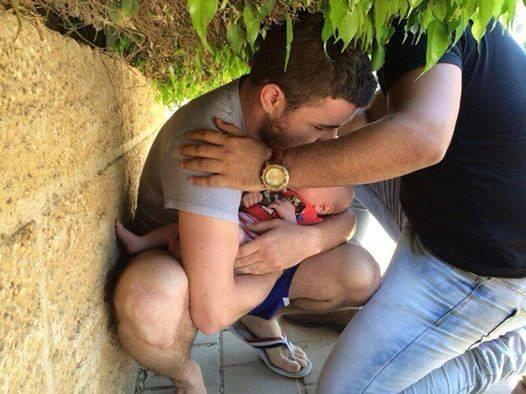 A stranger shields a father & his son as Beersheba, Israel, comes under rocket attack. NO NATION WOULD TOLERATE THIS
