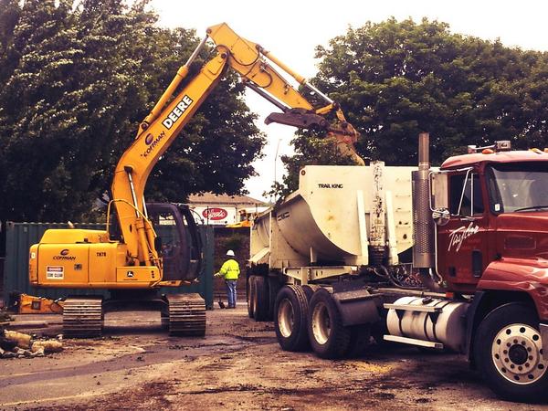 Cleaning up debris from the shrubs that lined Irving Street. #pearlwest #howardswright #pearldistrict #construction
