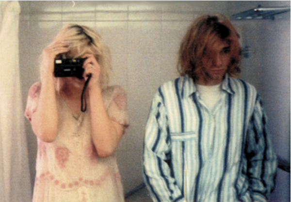 HistoryInPics's tweet photo. Kurt Cobain and Courtney Love bathroom selfie, taken in their hotel during Nirvana’s 1992 Japanese tour http://t.co/0z88LmavTC
