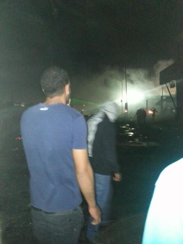 Lemapal's tweet photo. Qalandia is a war zone . Lots of injuries laser are on everyone #48kmarch http://t.co/dKYSusLfjw