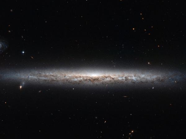 WIRED's tweet photo. Space Photo of the Day: A thin, glowing streak of a galaxy http://t.co/s00zsJaeQP http://t.co/z83e6iPIgq