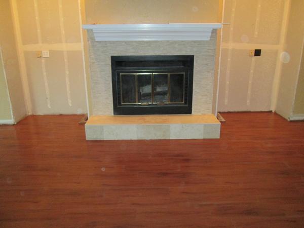 acetile's tweet image. Tile fireplace. Tile floor. Wood plank tile. #tile #woodplank #fireplace