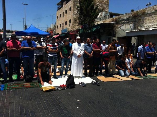 After Israeli forces blocked them from praying inside masjed AlAqsa they prayed on the streets of Jerusalem...