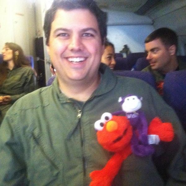 CATE_ucf's tweet photo. CATE's best friend, the purple monkey named SLOTH, has made a friend on the flight! #Elmo #Monkey #Sloth #CATE http://t.co/EcmUQ9Yx18