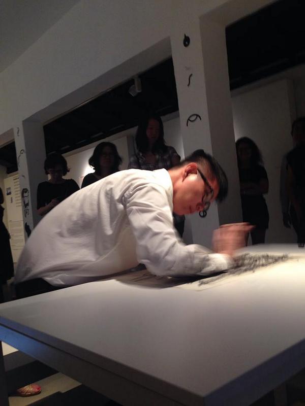 Artist Boedi Widjaja, performing last night at the opening of "A Drawing Show" at Yeo Workshop.