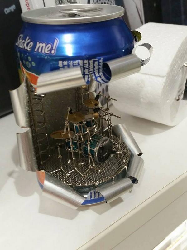Know's tweet photo. There is someone out there that spends his or her time creating tiny drum sets inside soda cans. http://t.co/HV02E00DNT