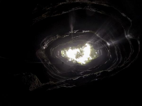 drainhook's tweet photo. My young friend Daniel, descending into Neversink, a 178' sinkhole cave, just before dark.#caving #adventure #travel http://t.co/sg1hoUOT9Q