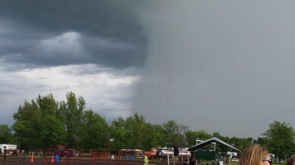 Rain shower passing south of the Marshall County Fair in Warren, MN earlier. Photo courtesy Denise Gudvangen. #mnwx