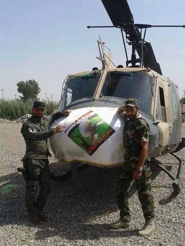 halsader's tweet photo. Peace brigades re-capturing a helicopter after defeating ISIS in Samrra, Iraq http://t.co/t4maGTvji0