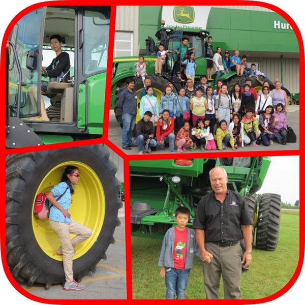 ArtAroundTown's tweet photo. Yesterday, members of the Angel Choir visiting #ExeterON from Beijing toured @HuronTractorLtd  Sure looks like fun! http://t.co/V9Aw6bst46