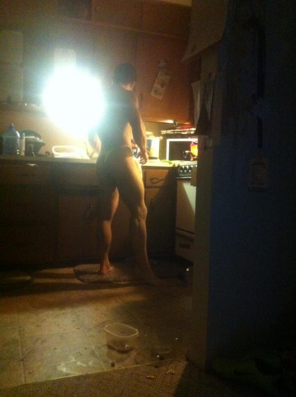 My wifey likes to take sneaky pics of me. This how I cook her food! In my birthday suit!
