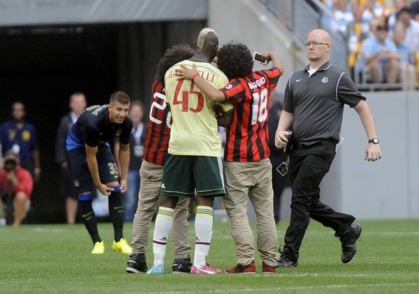 IntoTheUncommon's tweet photo. At the game yesterday, two guys jumped out in front of me on the field for a selfie with AC Milan's Mario Balotelli. http://t.co/xPH5KUziek
