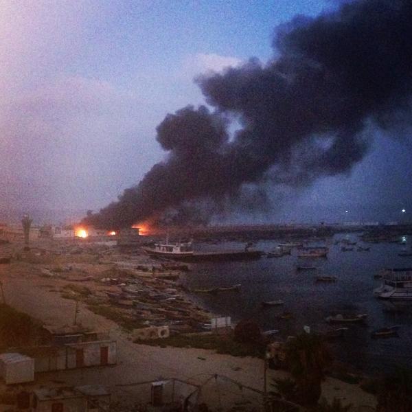 ImtiazTyab's tweet photo. The view from my room. #Gaza's port on fire. Blast so intense our hotel shook. Some windows blown in. http://t.co/xK1imYlm5x