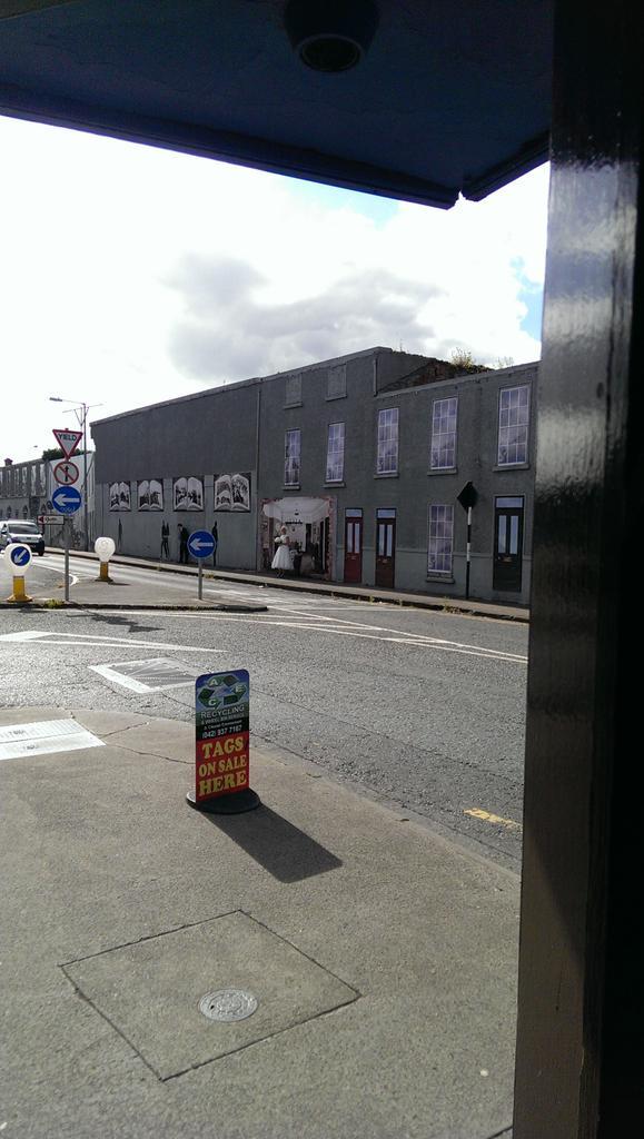 Bride &amp; groom getting their photo taken at wall in quay street <a href="/DundalkTT/">Dundalk Tidy Towns</a>