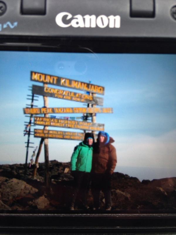 We did it! Summited Kili's 19.341 ft ASL Uhuru Peak yesterday morning at 7am! Here's a pic of a pic to prove it.