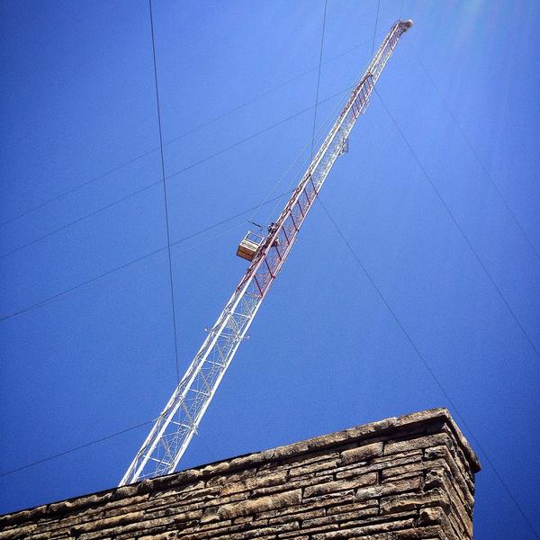 Men at work on the station's tower today. Those poor brave souls climbed all the way to the top.
