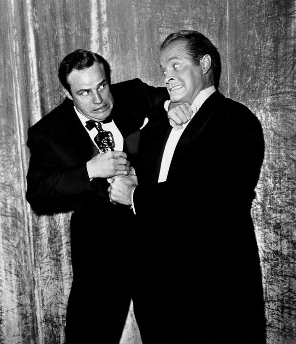 ClassiqueCinema's tweet photo. Bob Hope trying to steal Marlon Brando’s newly acquired Oscar http://t.co/aQzEJxYchs