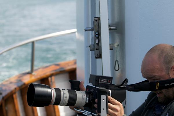 TimeRules_media's tweet photo. Harry shooting on board at Fanney, beautiful old icelandic oak boat #SalkaWhaleWatching #SkjálfandiBay #whales http://t.co/FxXPH1tkVr