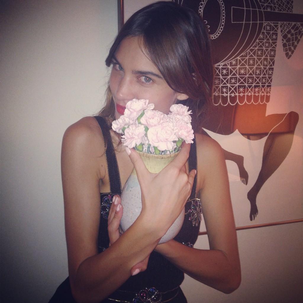   A photo of me holding some flowers.  Birthday my love...... 