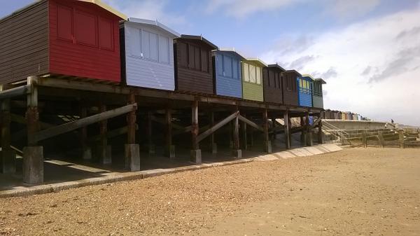 We love the #frinton #essex beach huts on stilts! They've got cute little patios on the other side