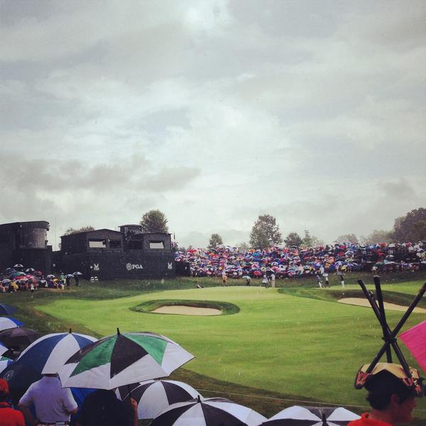 PGAChampionship's tweet photo. Rain won't stop us, that's why we have umbrellas...and chairs??? #creativefan #PGAChamp http://t.co/ykC9h91TM4