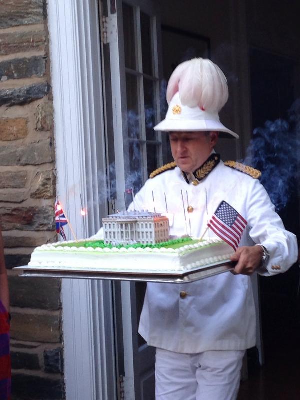 Action photo of the British Embassy cake for 200th anniversary of burning of WH &amp; Capitol