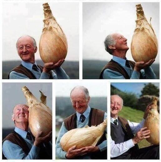 If you're having a bad day, just look at how happy this man is with his onion.