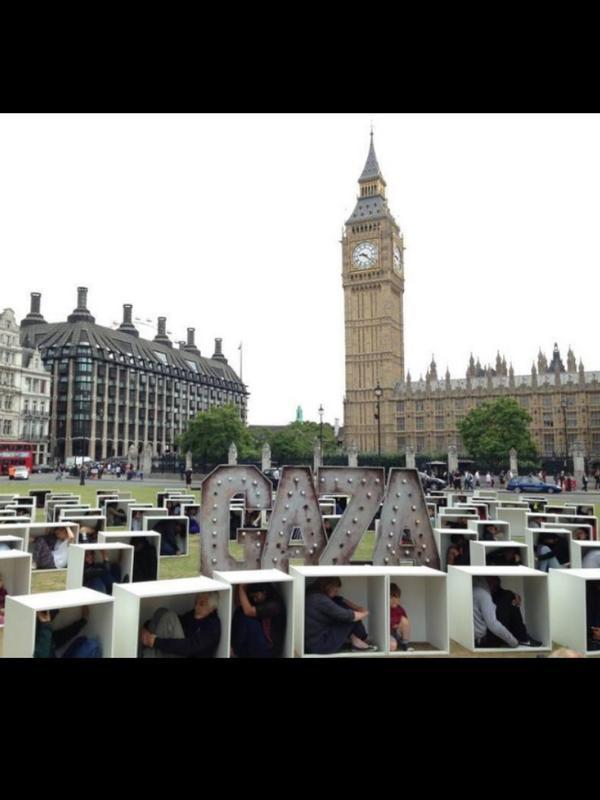 DrGilbert's tweet photo. dozens of people in UK themselves in closed boxes 2 express their rejection of the siege of #Gaza http://t.co/F2GQcFYi7D