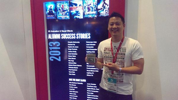 vfs's tweet image. One of our talented Admissions Advisors holding up his prized Pixar teapot! #SIGGRAPH2014