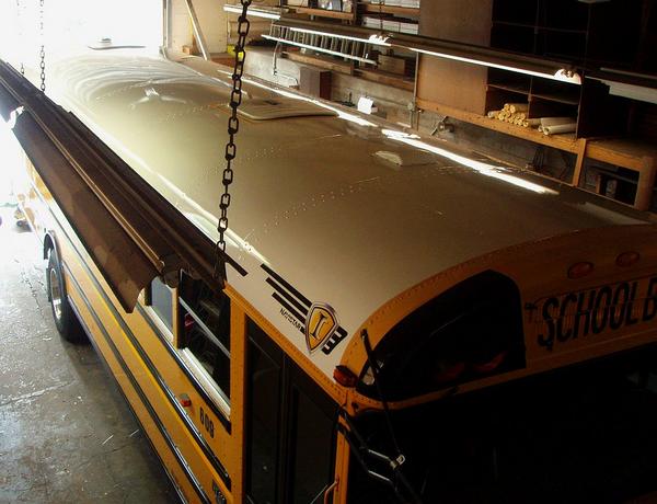 Here is the bus project - it came new without a white roof. We added that and other graphics, for comfort and safety!