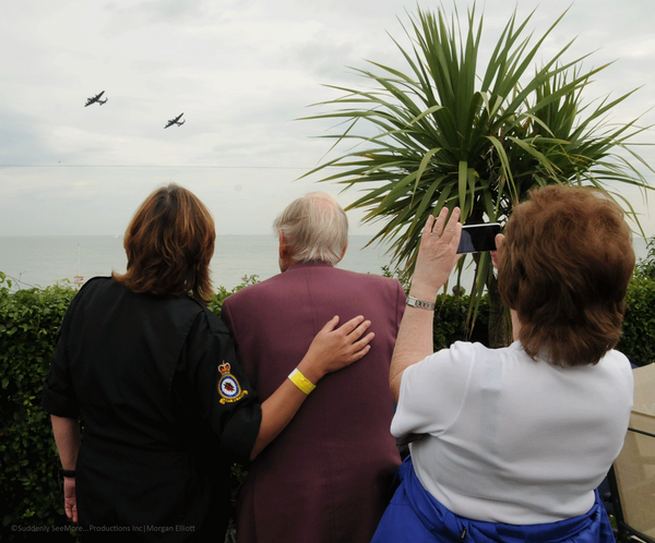 Yv from <a href="/RAFBBMF/">RAF BBMF</a> watching the #2LancsUK with a 91 year old Veteran and his daughter. Perfect. #lestweforget <a href="/CWHM/">Canadian Warplane Heritage Museum</a>