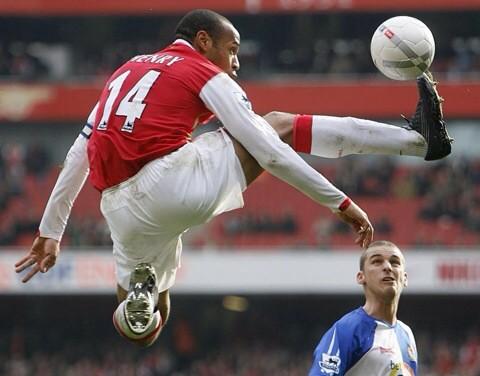 David Bentley photo bombing the picture that represents the legendary status of Thierry Henry at Happy Birthday 