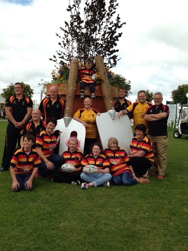southportflower's tweet image. Southport Rugby Club make a stop at the giant plant pot.