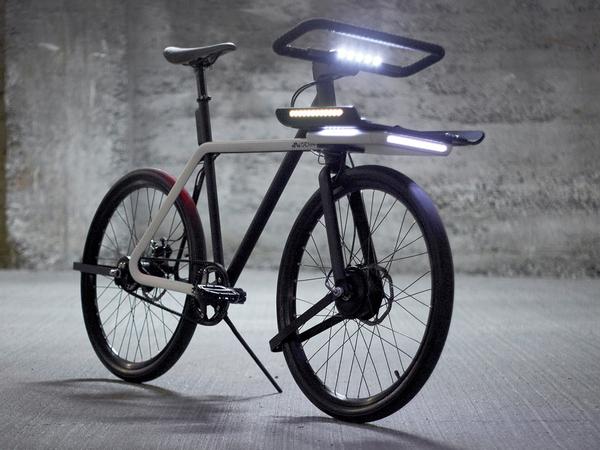 WIRED's tweet image. This bike is filled w/ understated, clever design ideas - like handlebars that become a lock  wrd.cm/YrbNee
