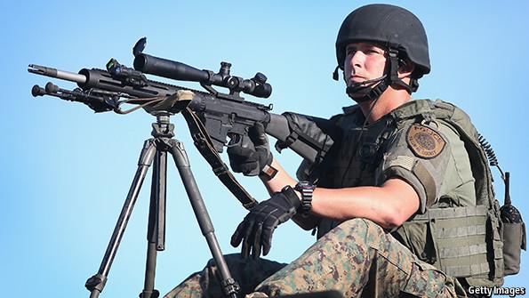 TheEconomist's tweet photo. The Economist explains how America's police became so well armed http://t.co/o1CRRnkz8n #Ferguson http://t.co/ySO8brnFEx