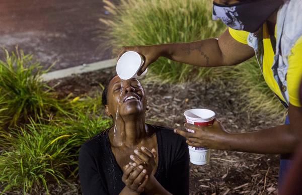 thenation's tweet photo. Police in #Ferguson are spraying a civilian population with miscarriage-causing chemicals. http://t.co/HWvd3crHBL http://t.co/jBgUG73zOM