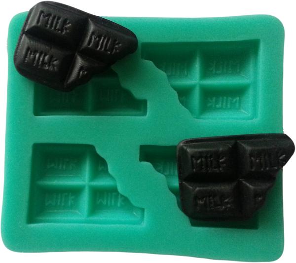 SiliconeKit's tweet photo. It is so easy to create using our moulds, today, bitten dark chocolates. http://t.co/4w28I9rLTO