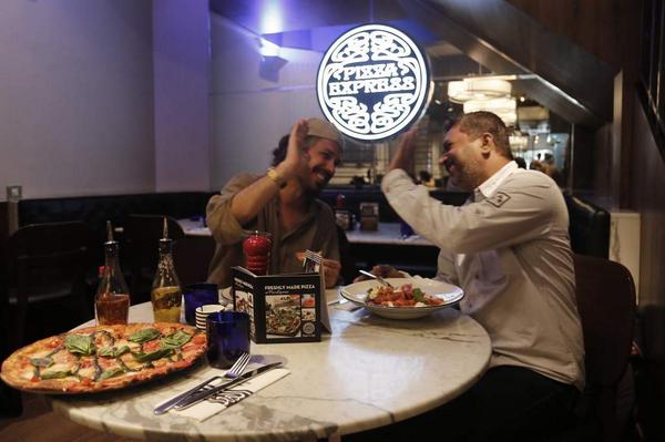 PizzaExpressIN's tweet photo. Yup! They approve the pizza. Stefano n Anand jamming for #sliceofart. You guys submit your entries yet? http://t.co/V7wvmqnHmt