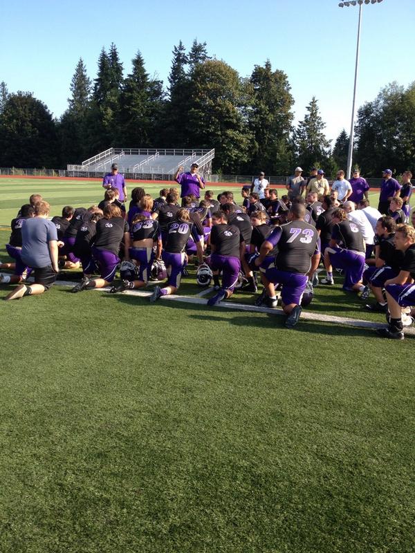 Lake Stevens head coach Tom Tri addresses his team as the Vikings wrap up their first practice
