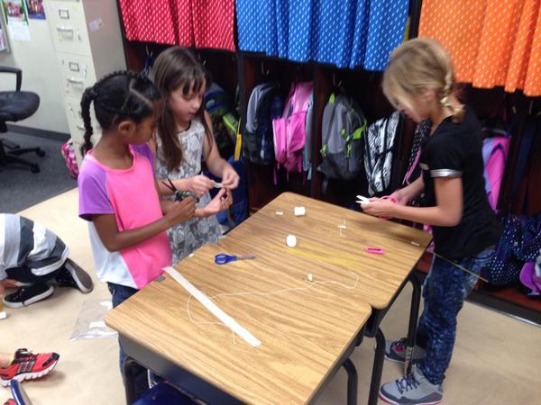 ldouce17's tweet photo. Team building in room 202...we had 2 teams build standing towers.  Such pride! #dweclassroom http://t.co/5oXN7X38y0