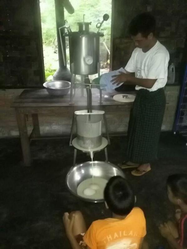 Our soy milk manager working to produce today's order of milk.  Thanks Thomas!! <a href="/unchartedintl/">Uncharted Intl</a>